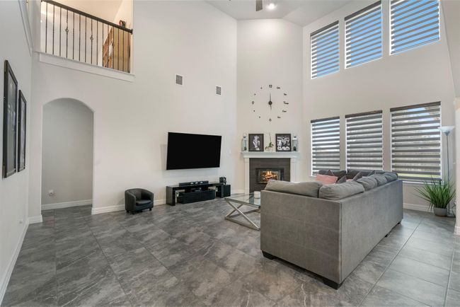 Open design, High ceilings, Large windows Cozy fireplace, Abundant natural light | Image 9