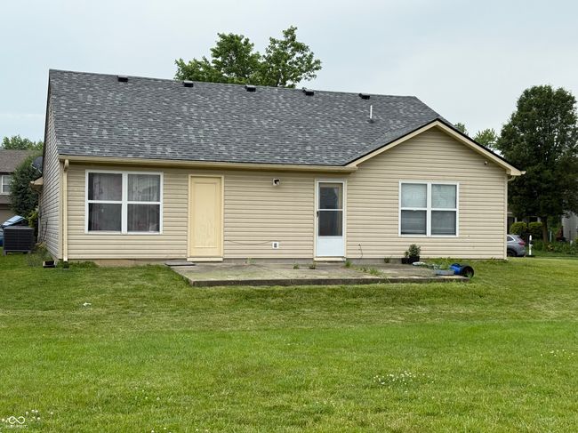 back of property with roof with shingles and a lawn | Image 17