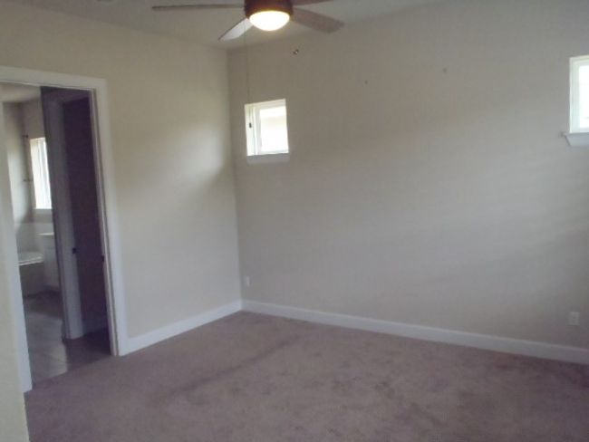 Unfurnished room with a ceiling fan and carpet | Image 22