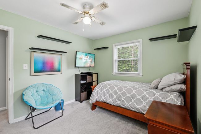 Bedroom with carpet flooring and ceiling fan | Image 15