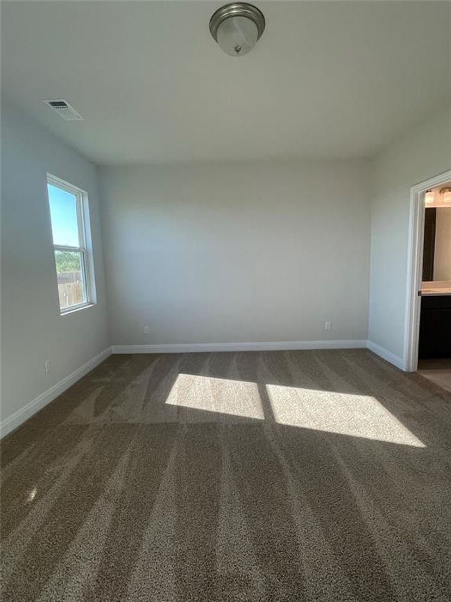 Spare room featuring carpet floors and baseboards | Image 8
