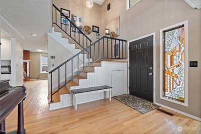 Enjoy soaring ceilings and hardwood floors as you enter. | Image 3