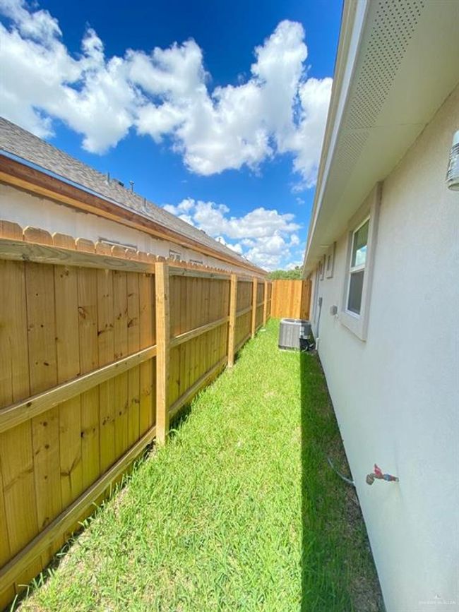 View of fenced backyard | Image 7