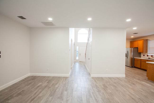 Spare room featuring light wood-style floors and recessed lighting | Image 17