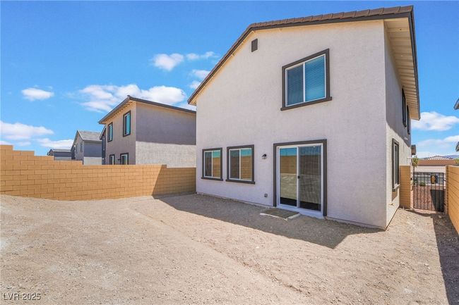Rear view of property with a fenced backyard and stucco siding | Image 33