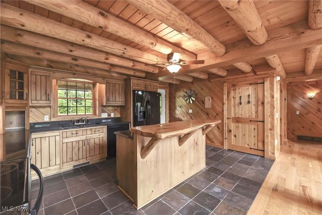View of kitchen toward storage closet. | Image 6