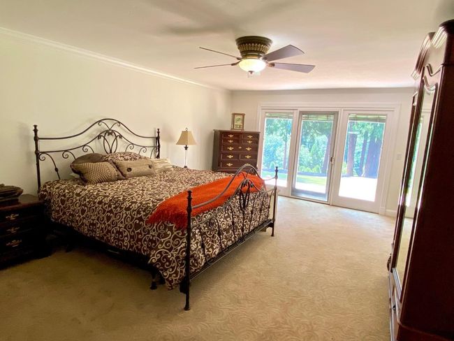 Master bedroom downstairs has wonderful view, Pella slider with blinds inside the glass panes. | Image 28