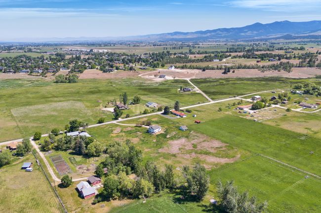 Aerial view of property's location with rural landscape and mountains | Image 64