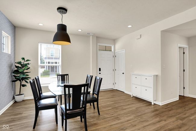 Guest entry with added storage and coat closet, formal dining space, access to half bath and mechanicals | Image 6