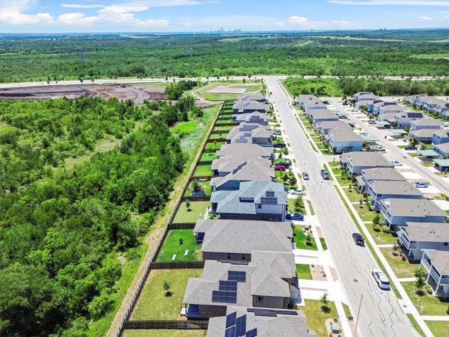 Aerial perspective of suburban area with a forest | Image 26