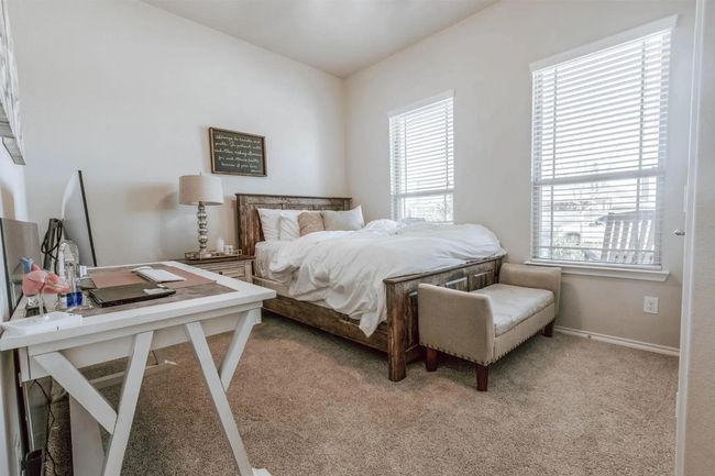 Bedroom with light carpet, multiple windows, and baseboards | Image 14