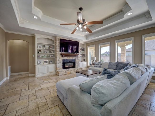Stone fireplace with electric decorative fireplace | Image 6