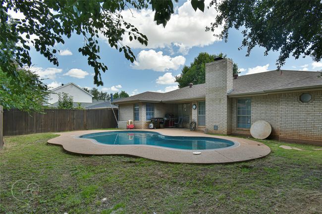 View of pool featuring a fenced backyard and a patio | Image 4
