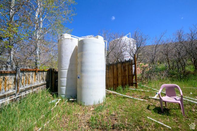 View of outdoor structure featuring fence | Image 54