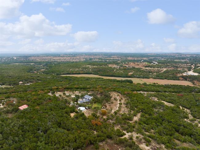 Drone / aerial view featuring a wooded view | Image 35