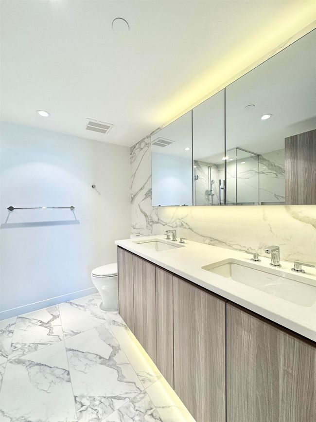 Bathroom featuring baseboards, visible vents, a sink, and toilet | Image 15