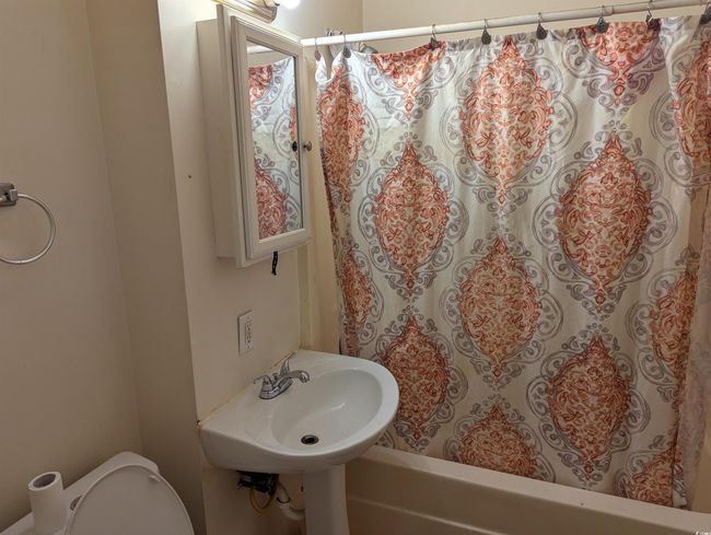 Full bath featuring toilet and shower / bath combo | Image 4