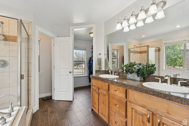 Bathroom with a shower stall and double vanity | Image 15