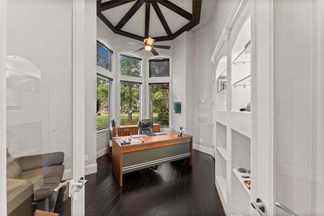 Situated at the front of the home, a dedicated home office offers the perfect blend of privacy and productivity, complete with elegant French doors and natural light... | Image 22