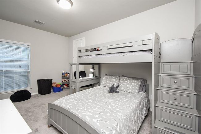 Biggest of the secondary bedrooms this spacious room is on the other side of the Jack and Jill bathroom | Image 8
