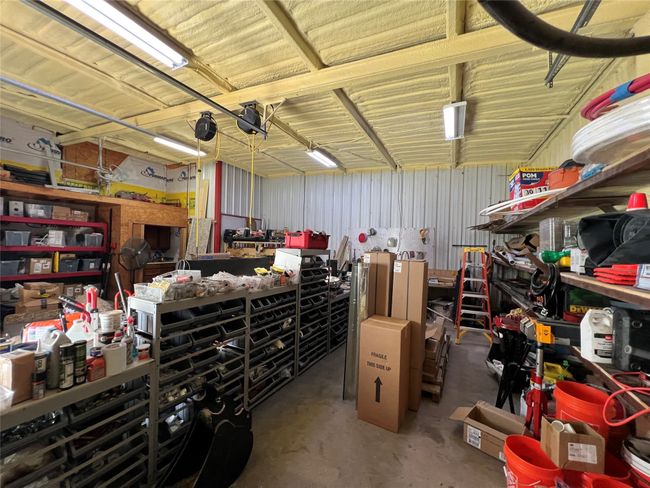Garage with a workshop area | Image 37
