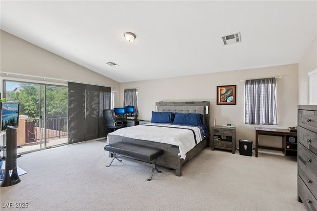 Bedroom with lofted ceiling, carpet flooring, and access to exterior | Image 45