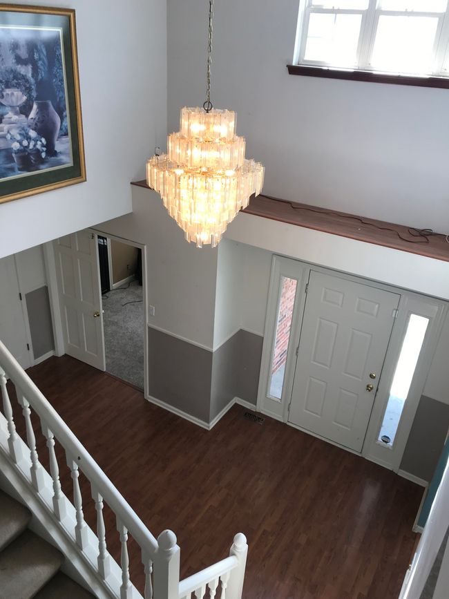 View from upstairs looking down at the foyer. | Image 5