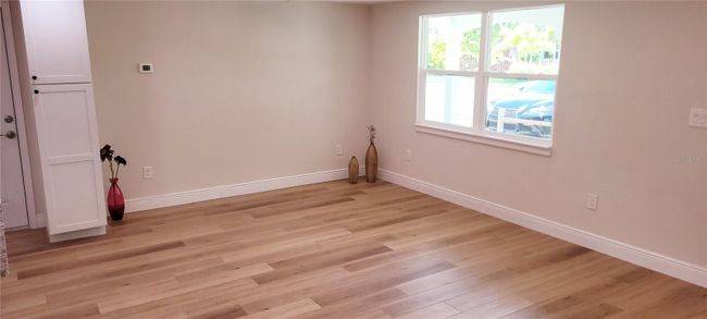 Open living room with pantry cabinet-all new windows | Image 6