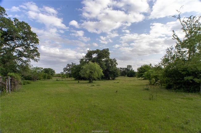 View of green lawn with a view of countryside | Image 20