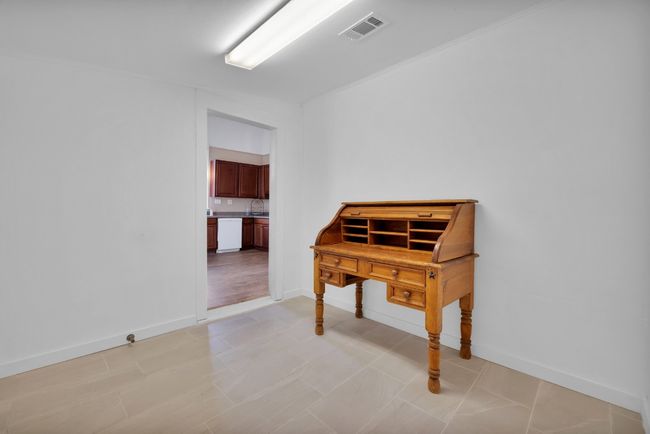 Corridor with visible vents and baseboards | Image 14