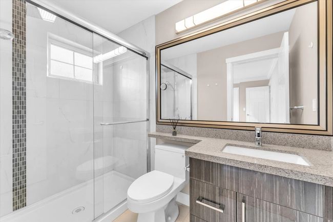 Bathroom featuring vanity and a shower stall | Image 18