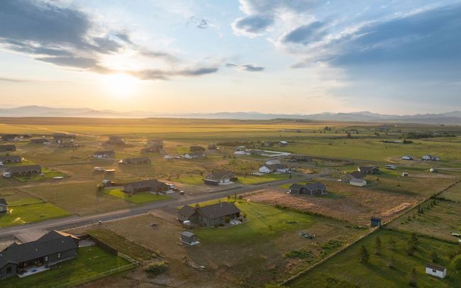 Aerial overview of property's location featuring a mountain backdrop and rural landscape | Image 34