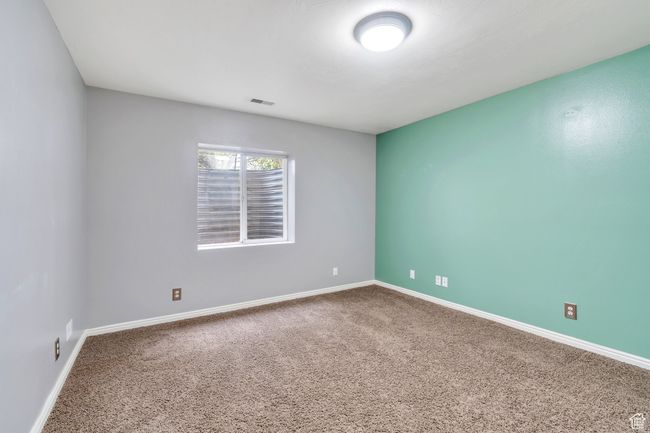 Unfurnished room with baseboards, visible vents, and carpet floors | Image 27