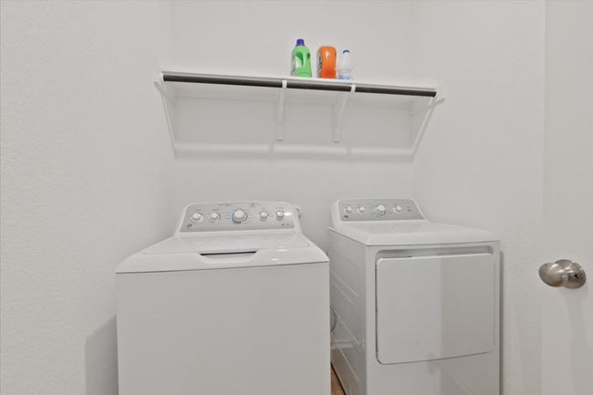 Washroom featuring separate washer and dryer and laundry area | Image 18