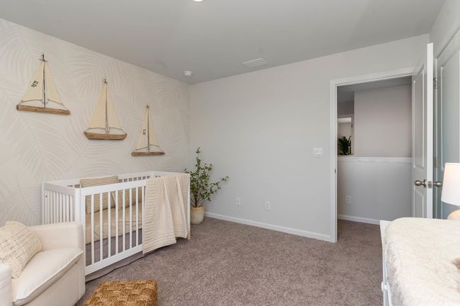 Carpeted bedroom featuring baseboards | Image 22