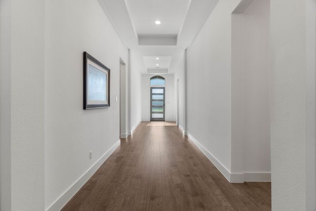 Hall with dark wood finished floors, baseboards, and recessed lighting | Image 17