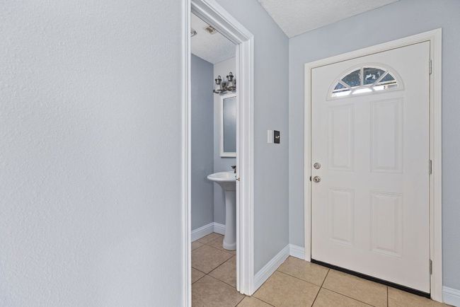 Tucked just off the entryway, the half bath is perfectly placed—easy for guests, convenient for everyday life. | Image 20