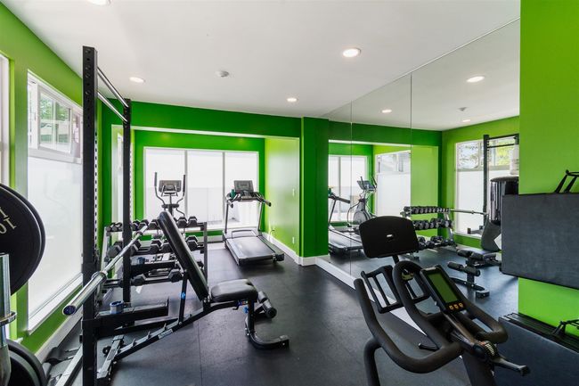 Exercise room featuring plenty of natural light and recessed lighting | Image 24
