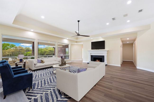 View of main living area looking toward pool and main fireplace. | Image 17