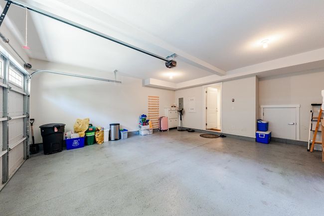 Garage with a garage door opener and electric panel | Image 31