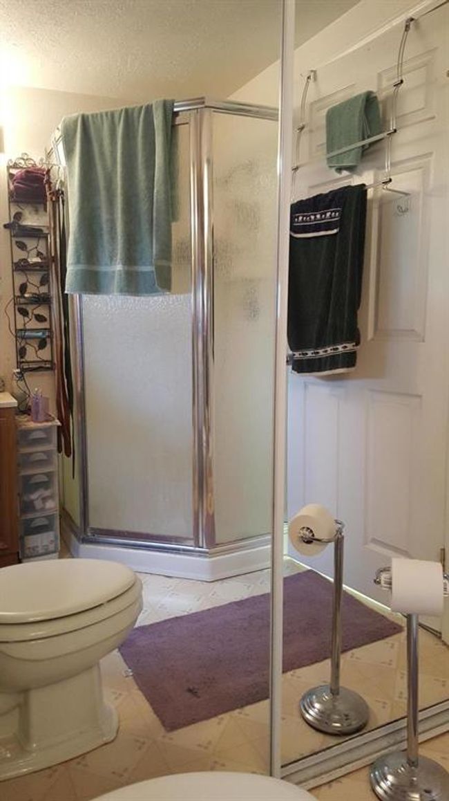Full bath featuring toilet and a shower stall | Image 29
