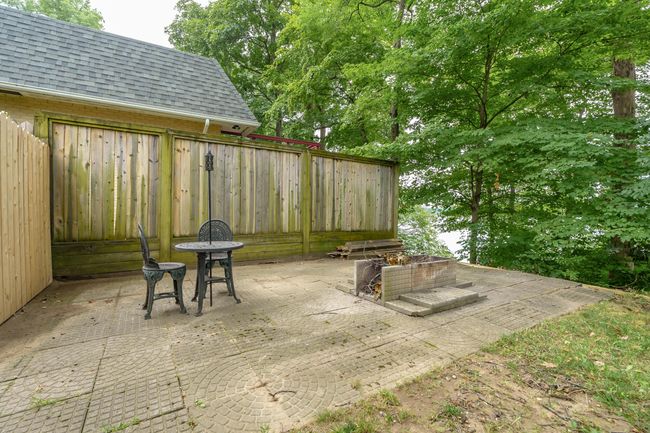 Patio located at the end of large deck | Image 42