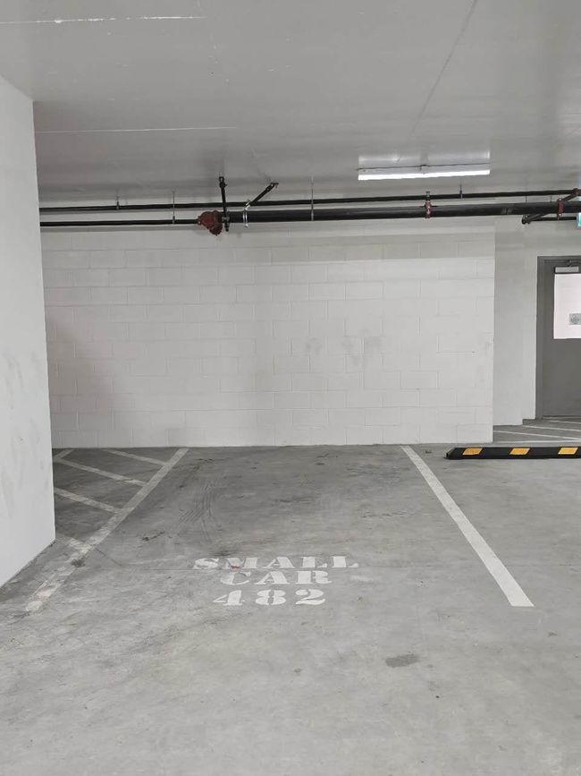 Parking garage featuring concrete block wall | Image 29