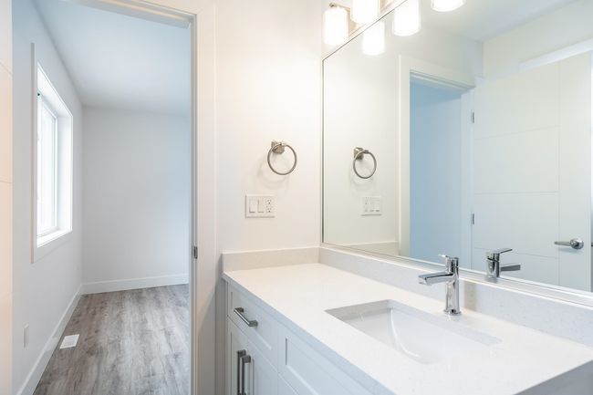 Bathroom featuring vanity, wood finished floors, and baseboards | Image 28