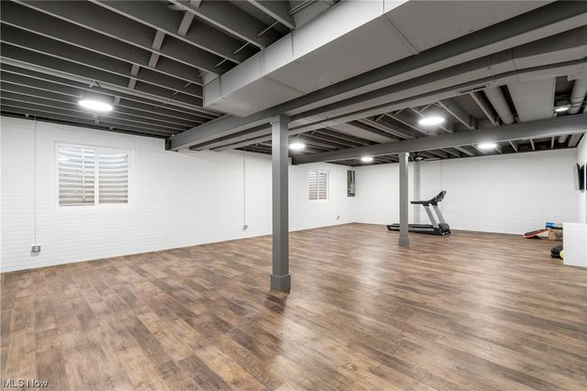 Recreation/exercise room featuring dark hardwood / wood-style flooring | Image 28