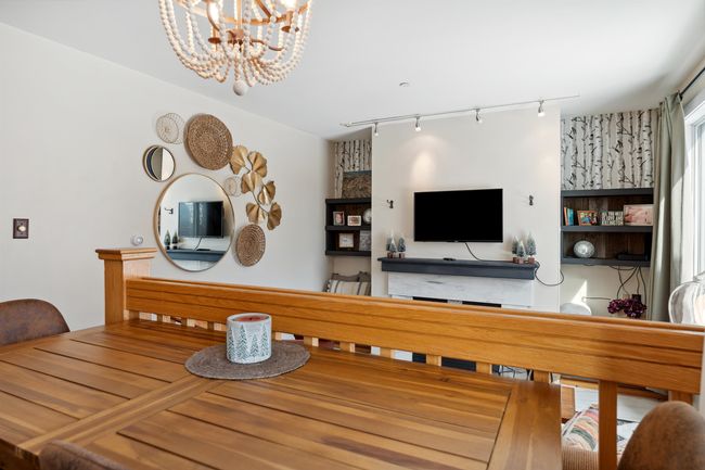 Dining area looking into the living area | Image 6