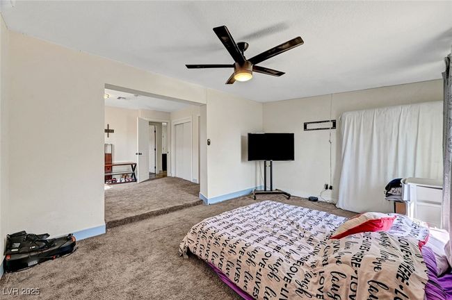 Carpeted bedroom featuring baseboards and ceiling fan | Image 28