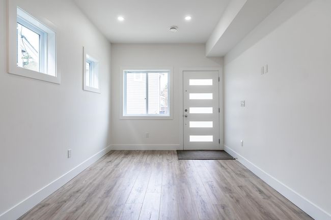 Entryway featuring wood finished floors, baseboards, and recessed lighting | Image 5