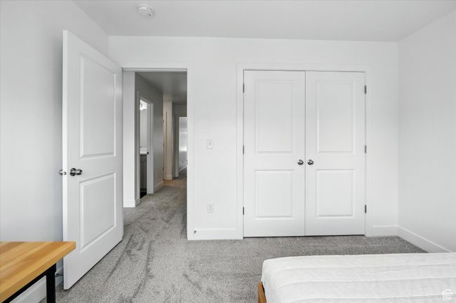 Bedroom with carpet and a closet | Image 19