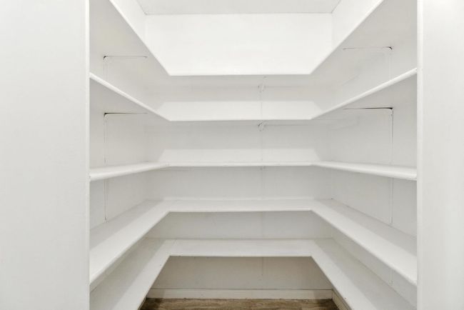 Pantry has plenty of storage shelves. | Image 10